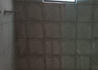 Bathroom Walls Post Construction Tile Cleaning ; Cement & Paint Removal . Before
